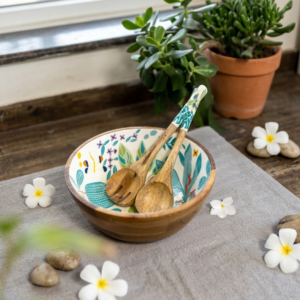 Salad bowl with two serving spoons