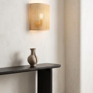 A four-panel product collage showcasing a semi-cylindrical woven rattan wall sconce in different hospitality settings, featuring natural, walnut, and black finishes alongside a close-up texture shot.