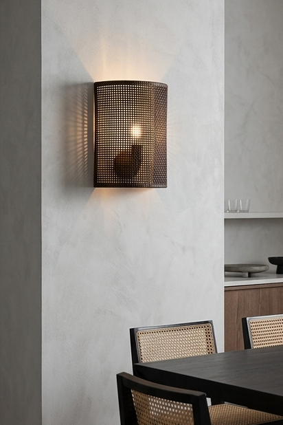 A four-panel product collage showcasing a semi-cylindrical woven rattan wall sconce in different hospitality settings, featuring natural, walnut, and black finishes alongside a close-up texture shot.